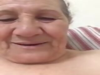 An old woman movies herself
